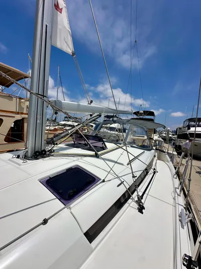 Kemosabe Yacht Photos Pics Jeanneau Sun Odyssey 440 sailboat docked, 2021 model, under clear blue sky.