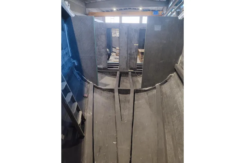  Yacht Photos Pics Interior view of 2026 Ice Yachts ICE 66 Farr under construction, showcasing hull structure.