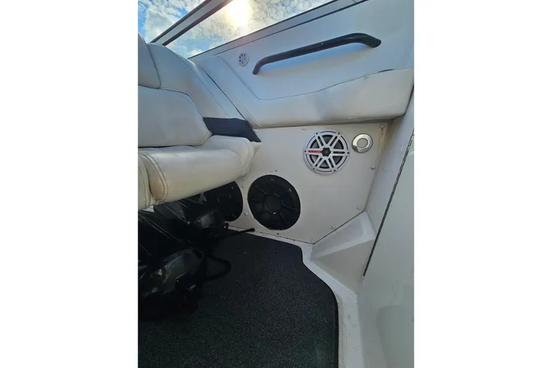 Tiret Yacht Photos Pics Interior of 2004 Fountain 42 Lightning boat with speakers and seating.