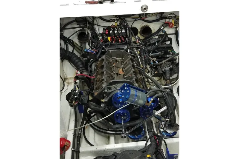 Tiret Yacht Photos Pics 2004 Fountain 42 Lightning engine compartment with complex wiring and components.