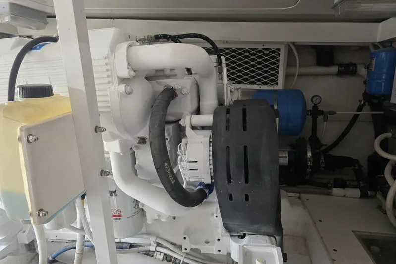 Junior 2 Yacht Photos Pics Engine room of a 2008 Post 42 model, featuring mechanical components and hoses.