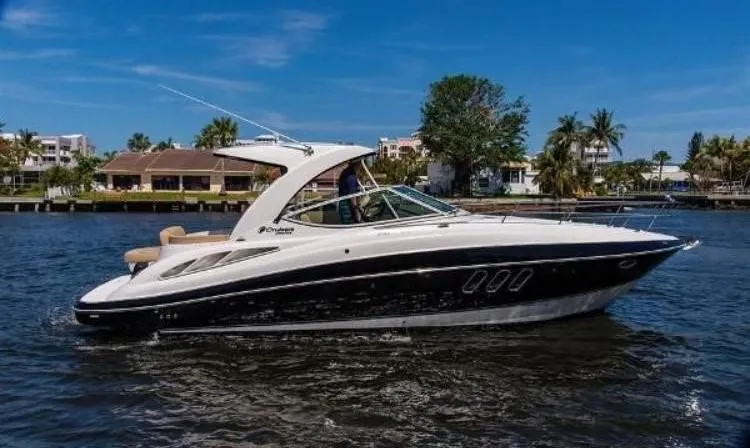 Seas The Day Yacht Photos Pics 2012 Cruisers Yachts 350 Express on water, sleek design, sunny day, waterfront background.