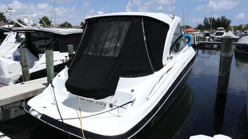 Seas The Day Yacht Photos Pics 2012 Cruisers Yachts 350 Express docked at marina, rear view with black cover.