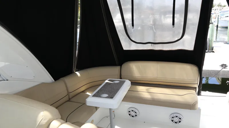 Seas The Day Yacht Photos Pics 2012 Cruisers Yachts 350 Express interior with beige seating and table.