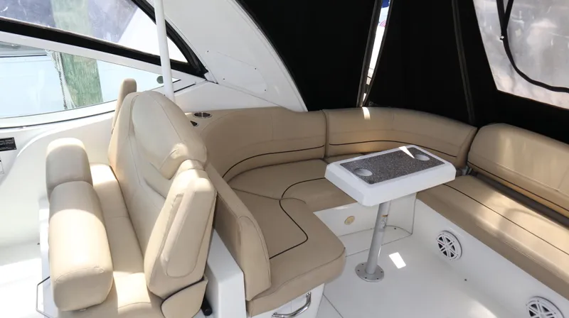 Seas The Day Yacht Photos Pics 2012 Cruisers Yachts 350 Express interior with beige seating and table.