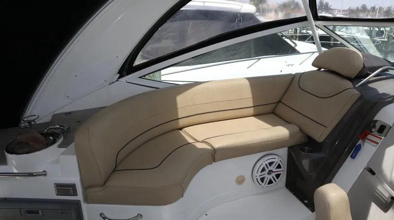 Seas The Day Yacht Photos Pics 2012 Cruisers Yachts 350 Express interior with beige seating and modern design.