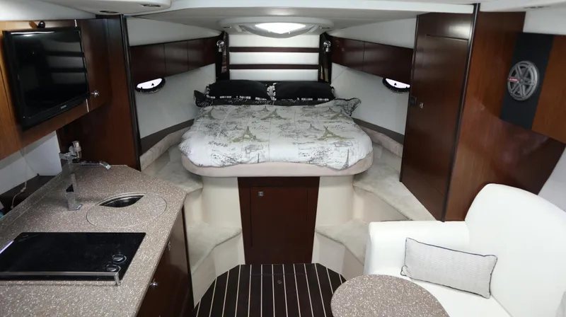 Seas The Day Yacht Photos Pics Luxurious interior of 2012 Cruisers Yachts 350 Express with bed, kitchenette, and seating area.