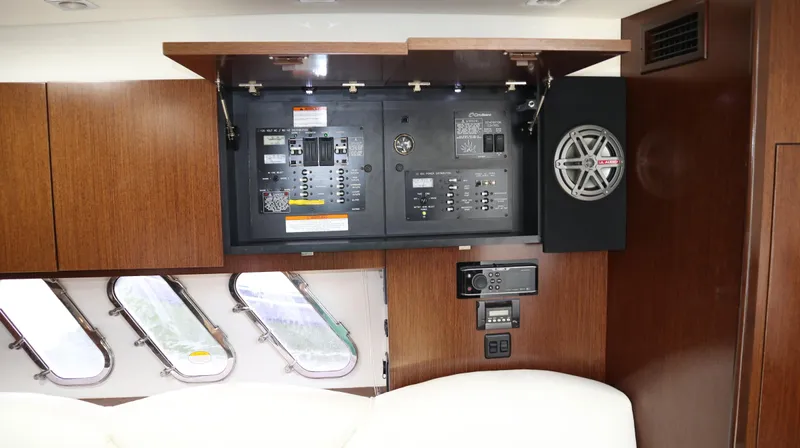 Seas The Day Yacht Photos Pics 2012 Cruisers Yachts 350 Express interior with control panel and speaker system.