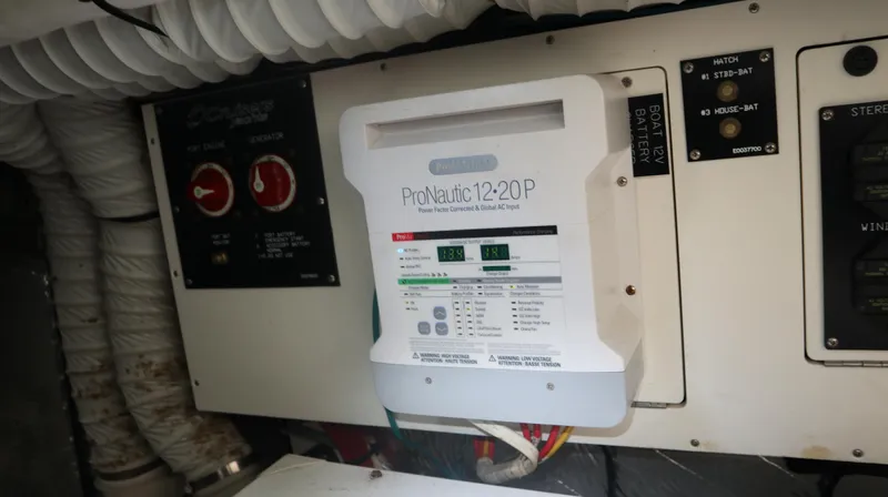 Seas The Day Yacht Photos Pics Electrical panel on a 2012 Cruisers Yachts 350 Express, featuring ProNautic 12-20P charger.