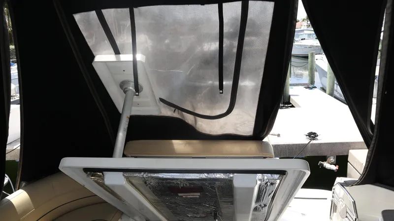 Seas The Day Yacht Photos Pics 2012 Cruisers Yachts 350 Express interior with covered seating and marina view.