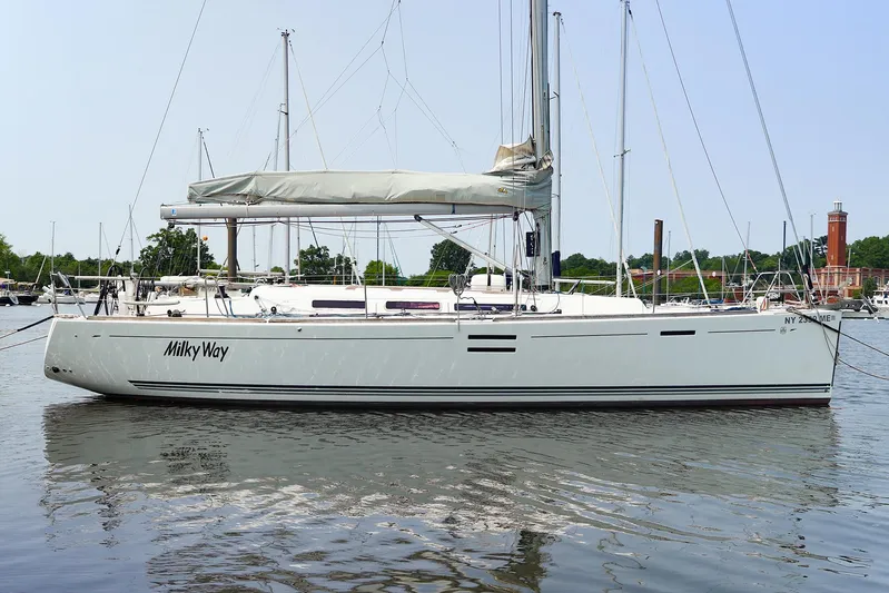  Yacht Photos Pics 2011 Dufour 40E Performance sailboat named "Milky Way" docked on calm water.