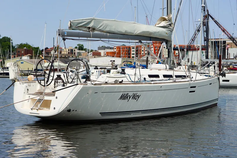  Yacht Photos Pics Sailing yacht Dufour 40E Performance 2011 docked in a marina, named "Milky Way".