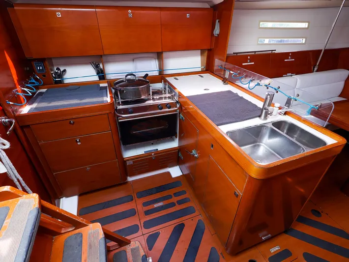  Yacht Photos Pics Luxurious 2011 Dufour 40E Performance yacht kitchen with wood cabinetry and modern appliances.