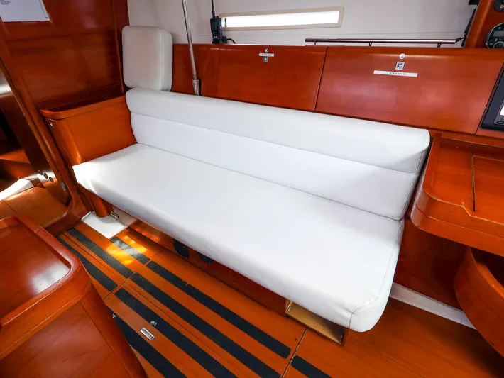  Yacht Photos Pics Interior of 2011 Dufour 40E Performance yacht with white seating and wooden finish.