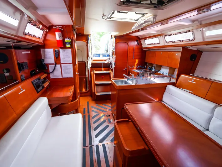  Yacht Photos Pics Interior of 2011 Dufour 40E Performance yacht, featuring wood finishes and modern amenities.