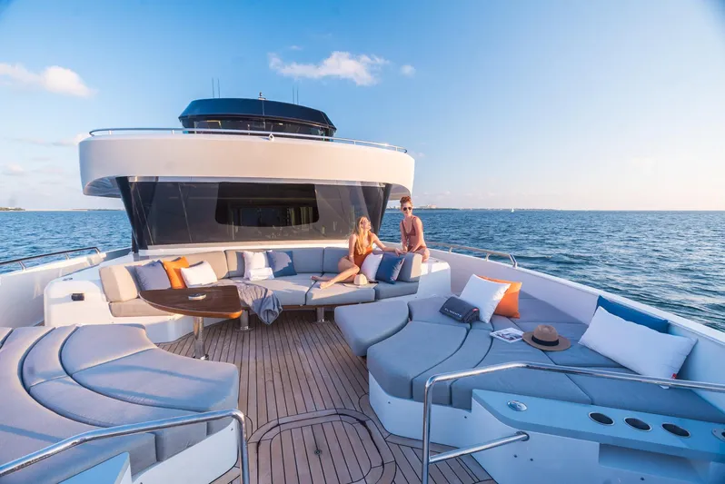  Yacht Photos Pics Luxurious 2022 CL Yachts CLX96 with spacious deck seating, cruising on open sea.