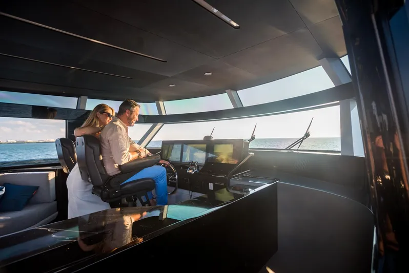  Yacht Photos Pics Couple enjoying the view from the helm of a 2022 CL Yachts CLX96.