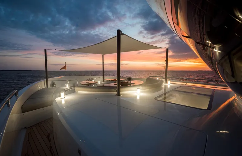  Yacht Photos Pics Luxurious 2022 CL Yachts CLX96 yacht deck at sunset, featuring elegant design and ocean views.