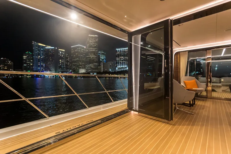  Yacht Photos Pics Luxurious 2022 CL Yachts CLX96 yacht with city skyline view at night.