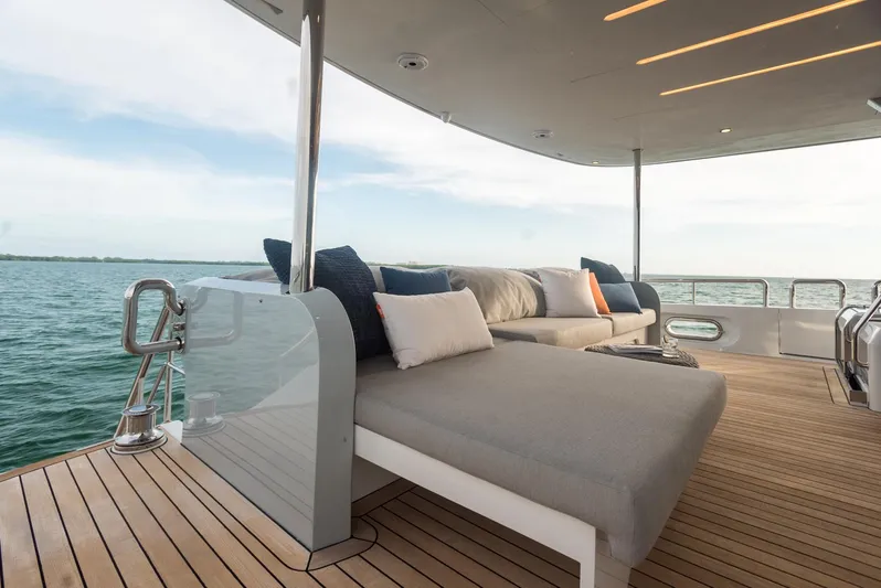  Yacht Photos Pics Luxurious 2022 CL Yachts CLX96 deck with comfortable seating and ocean view.
