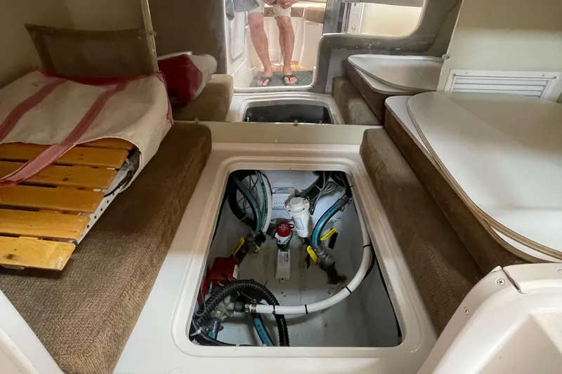 Muffin Yacht Photos Pics 2009 Grady-White Chesapeake 290 cabin interior with open engine compartment.