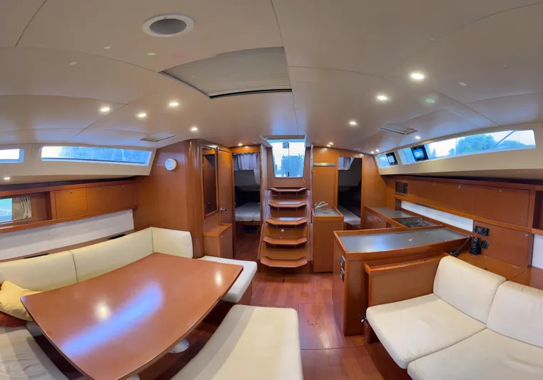 Samba Yacht Photos Pics Luxurious interior of 2012 Beneteau Oceanis 48 yacht with modern furnishings and spacious layout.