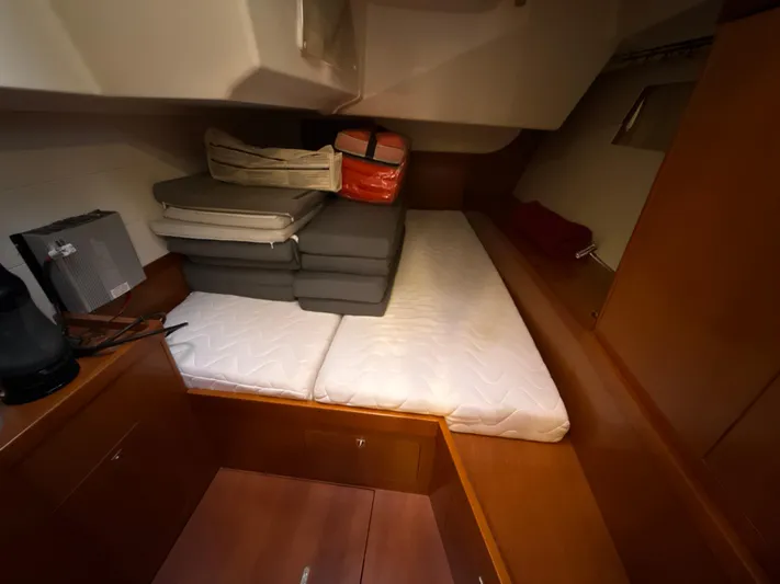 Samba Yacht Photos Pics Cabin interior of 2012 Beneteau Oceanis 48 yacht with cushions and storage.