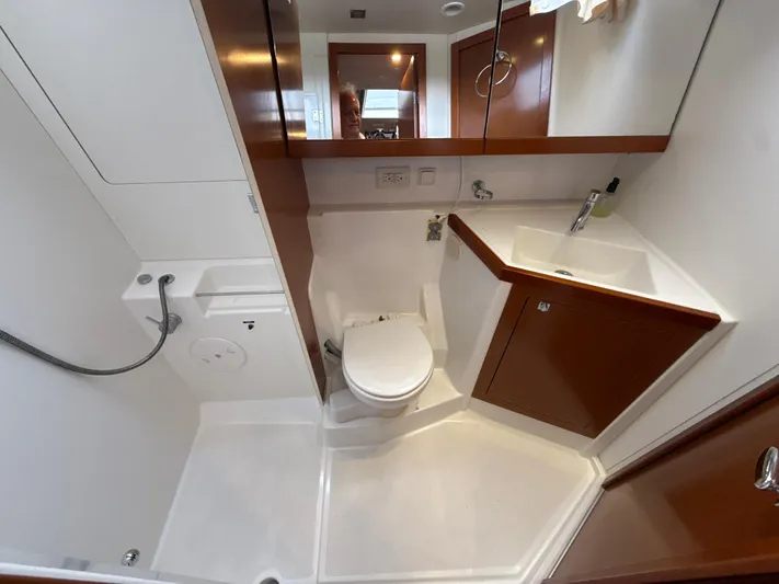 Samba Yacht Photos Pics Beneteau Oceanis 48 bathroom interior, featuring modern fixtures and wood accents, 2012 model.