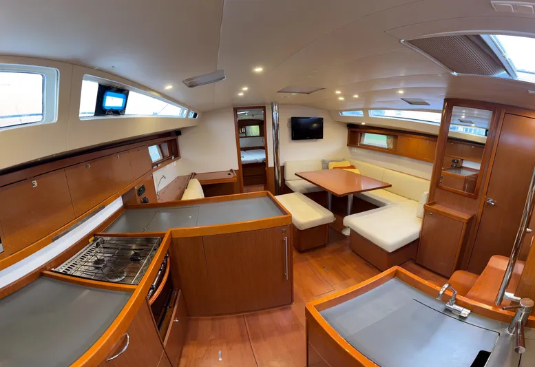 Samba Yacht Photos Pics Interior of 2012 Beneteau Oceanis 48 yacht with modern kitchen and dining area.