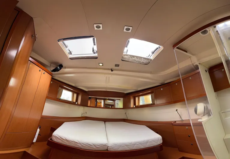 Samba Yacht Photos Pics Luxurious interior of 2012 Beneteau Oceanis 48 yacht with spacious cabin and skylights.