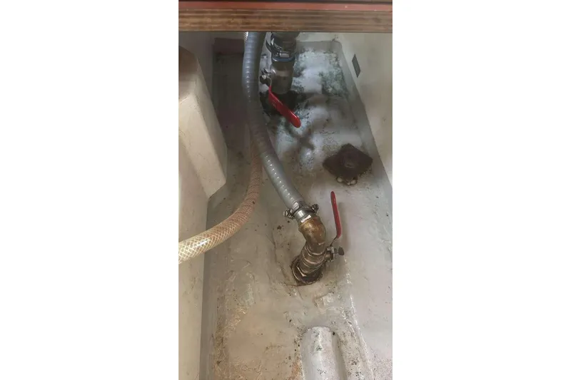 Samba Yacht Photos Pics Bilge area of 2012 Beneteau Oceanis 48 with visible hoses and valves.