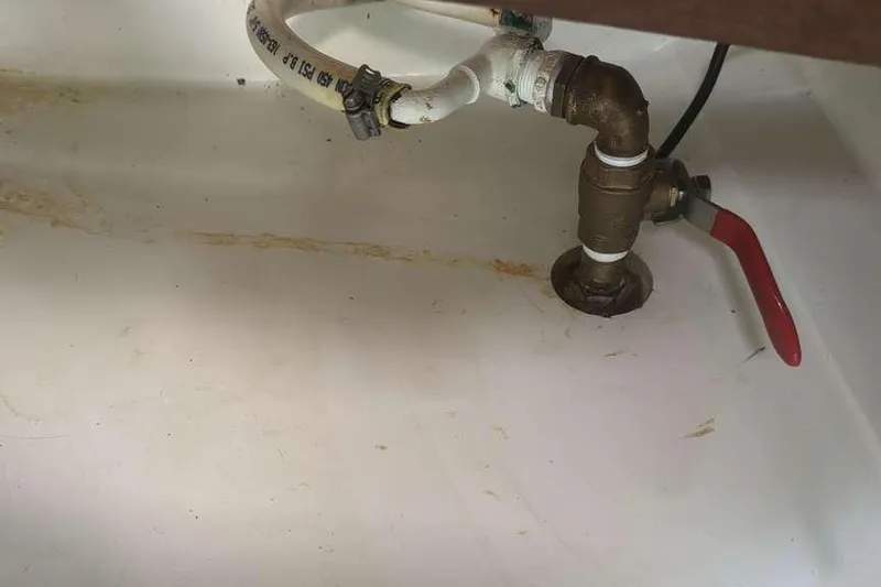 Samba Yacht Photos Pics Plumbing system in 2012 Beneteau Oceanis 48 yacht, featuring pipes and valve.