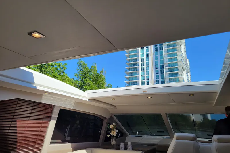  Yacht Photos Pics Interior view of 2017 Sea Ray Sundancer 460 yacht with cityscape background.