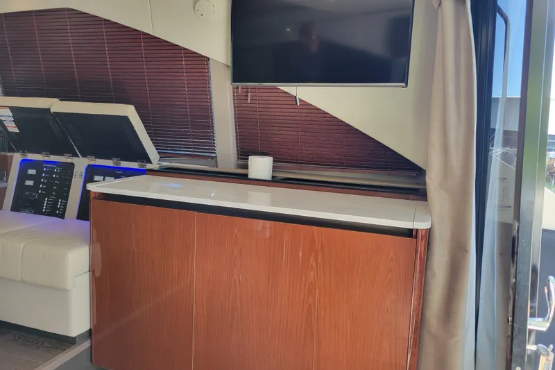  Yacht Photos Pics 2017 Sea Ray Sundancer 460 interior with TV, wooden cabinetry, and modern design.