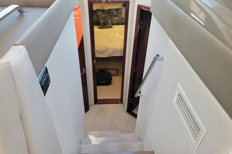  Yacht Photos Pics Interior view of 2017 Sea Ray Sundancer 460 yacht cabin with stairs and bedroom.