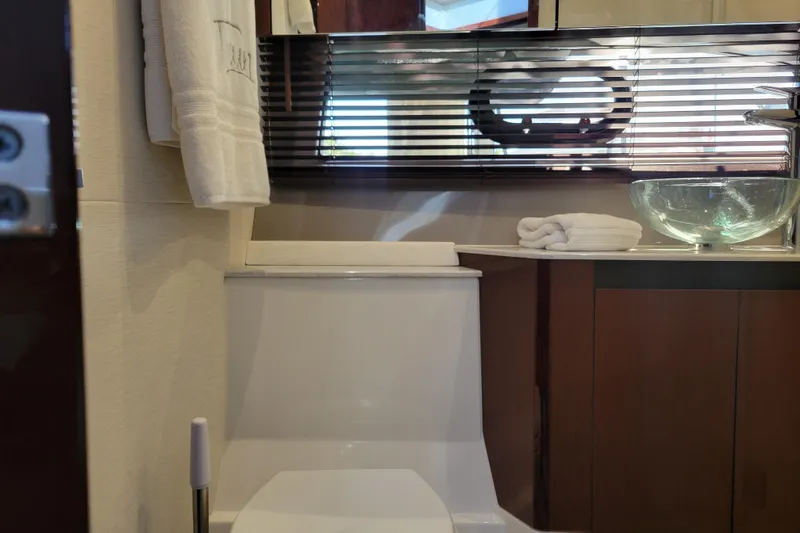  Yacht Photos Pics Luxurious bathroom in 2017 Sea Ray Sundancer 460 yacht with modern fixtures and glass sink.