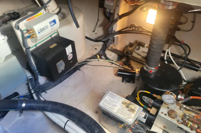  Yacht Photos Pics Engine room of a 2017 Sea Ray Sundancer 460 with various mechanical components.