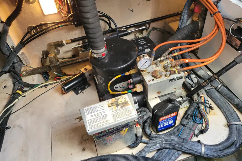  Yacht Photos Pics Engine room of a 2017 Sea Ray Sundancer 460 with mechanical components and wiring.