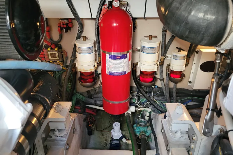  Yacht Photos Pics Engine room of 2017 Sea Ray Sundancer 460 with fire extinguisher and fuel filters.