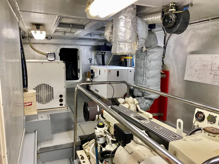 Bunyip I Yacht Photos Pics Engine room of a 2002 Nordhavn 47 yacht, featuring machinery and equipment.