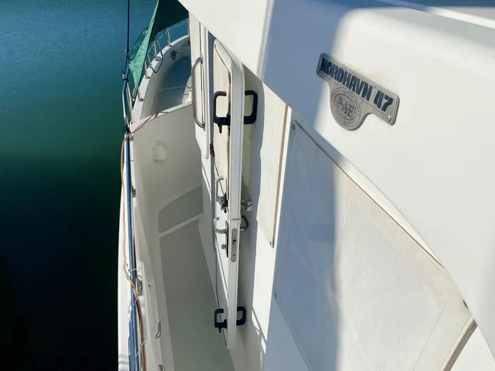 Bunyip I Yacht Photos Pics Nordhavn 47 yacht deck view, showcasing sleek design and branding, 2002 model.