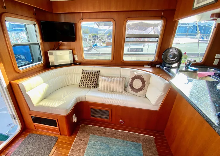 Bunyip I Yacht Photos Pics Luxurious 2002 Nordhavn 47 yacht interior with cozy seating and modern amenities.