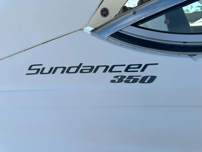 That's Amore Yacht Photos Pics 2015 Sea Ray 350 Sundancer boat logo on white hull.