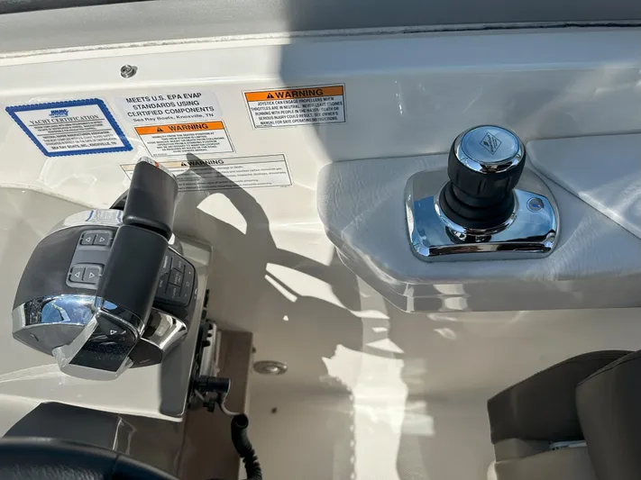 That's Amore Yacht Photos Pics Control panel of a 2015 Sea Ray 350 Sundancer boat with joystick and throttle.