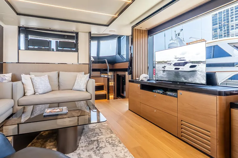 Available Now Yacht Photos Pics Luxurious interior of 2024 Absolute Navetta 68 yacht with modern furnishings and large windows.