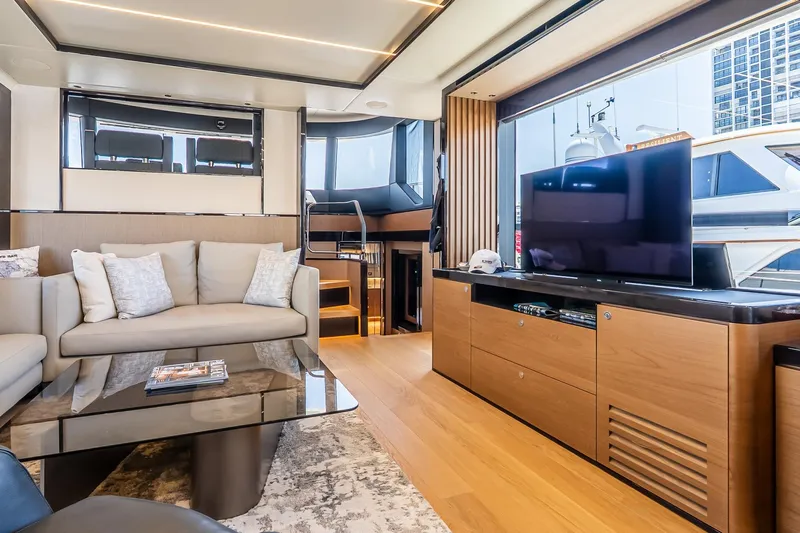 Available Now Yacht Photos Pics Luxurious interior of 2024 Absolute Navetta 68 yacht with modern furnishings and large TV.