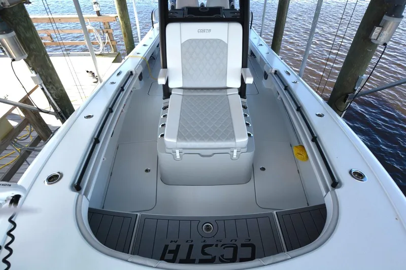 Carolina Bluewater Yacht Photos Pics 2024 Costa Custom Boats 264HC interior with cushioned seating and sleek design.
