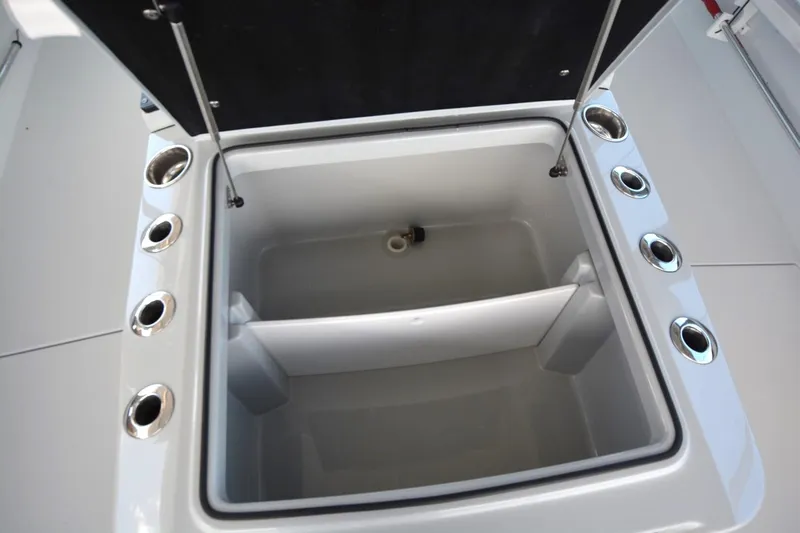 Carolina Bluewater Yacht Photos Pics Open storage compartment on 2024 Costa Custom Boats 264HC, featuring multiple cup holders.