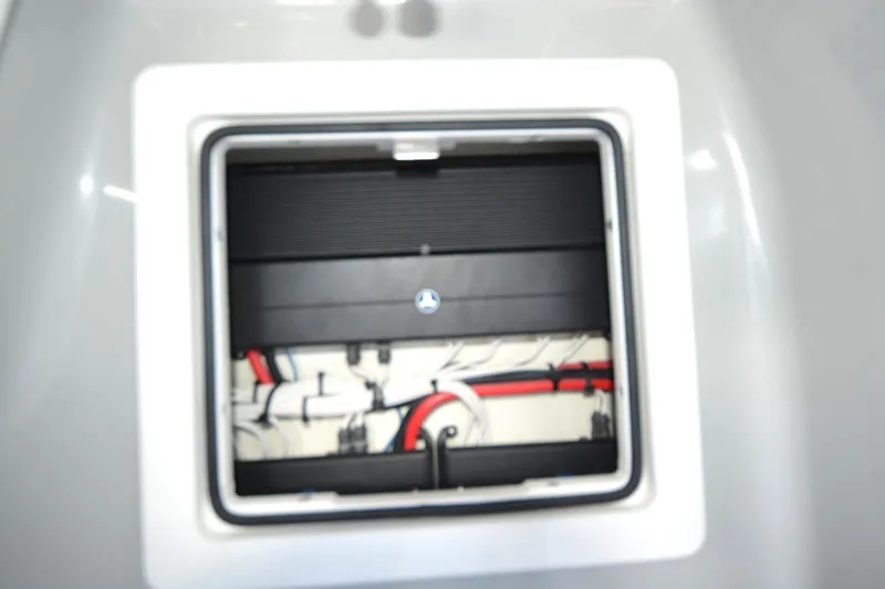 Carolina Bluewater Yacht Photos Pics 2024 Costa Custom Boats 264HC interior compartment with visible wiring and components.