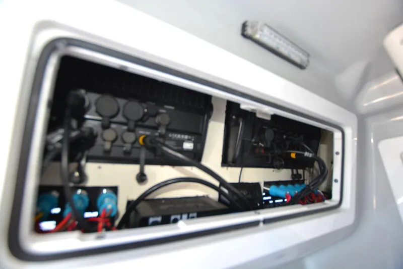 Carolina Bluewater Yacht Photos Pics Electrical compartment of 2024 Costa Custom Boats 264HC, showcasing wiring and components.